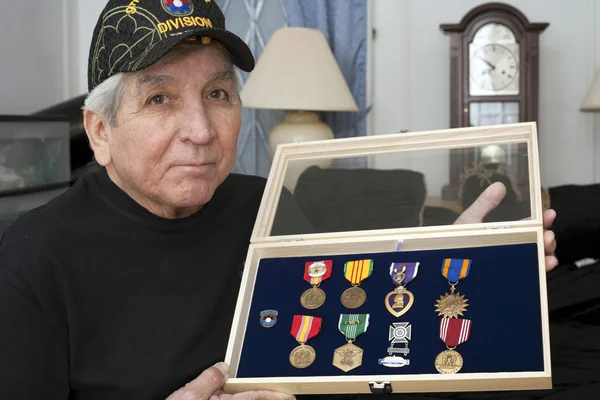 Vietnam vet looks over his medals — Stock Photo, Image