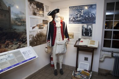 British uniform mannequin inside the Old Stone House clipart