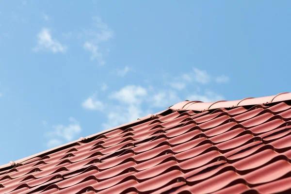 Roof covered with metal tile Stock Image