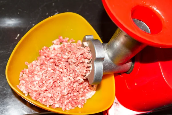 Raw minced grind in a meat grinder of different meats — Stock Photo, Image