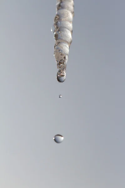 Icicle on a background of sky — Stock Photo, Image