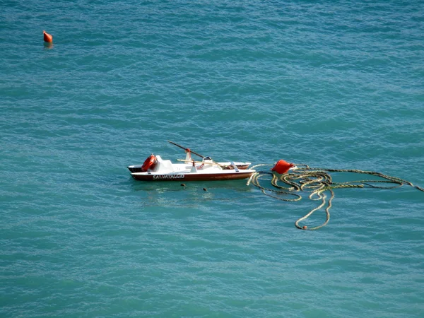 Lifeboat swimmers and buoy in the sea a — Stock Photo, Image