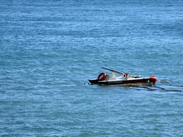 Lifeboat swimmers and buoy in the sea b — Stock Photo, Image