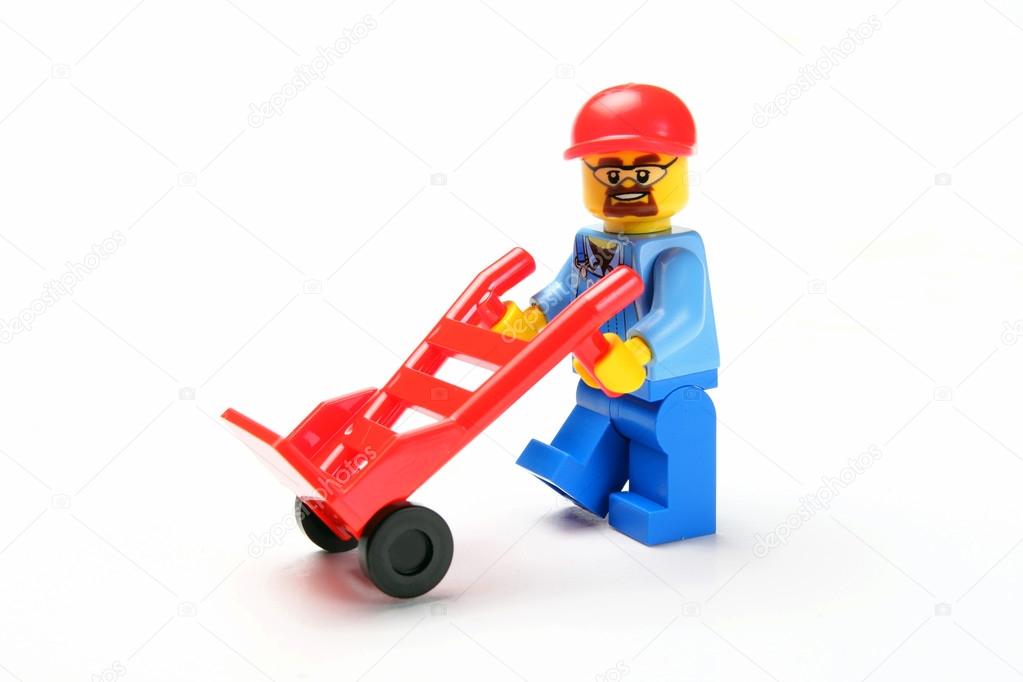 toy man whit hand truck a