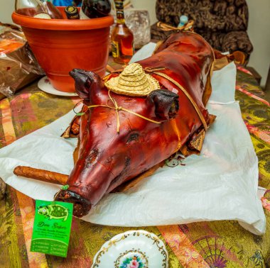 Home-made whole Cuban-Style Roast Suckling Pig prepared at a street party in Havana, Cuba clipart