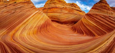 The Wave is a famous sandstone rock formation located in Coyote Buttes, Arizona, known for its colorful, undulating forms clipart