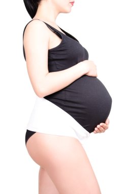 Pregnant woman in the supporting bandage for pregnant  clipart