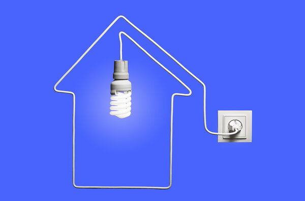Glowing lightbulb in a house