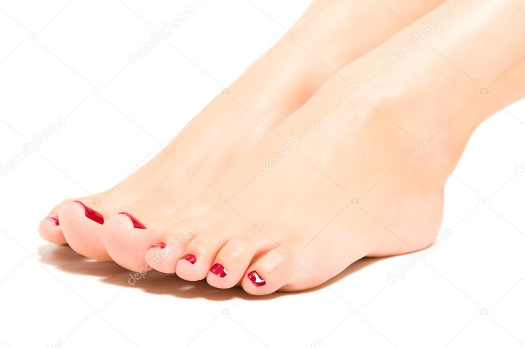Beautiful female foot with red pedicure