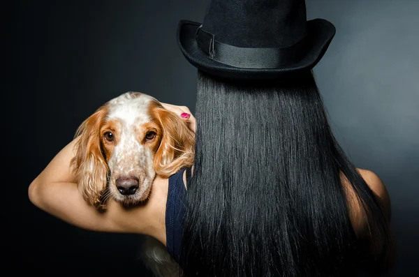 Portrait of a dog on the shoulder of a woman — Stock Photo, Image