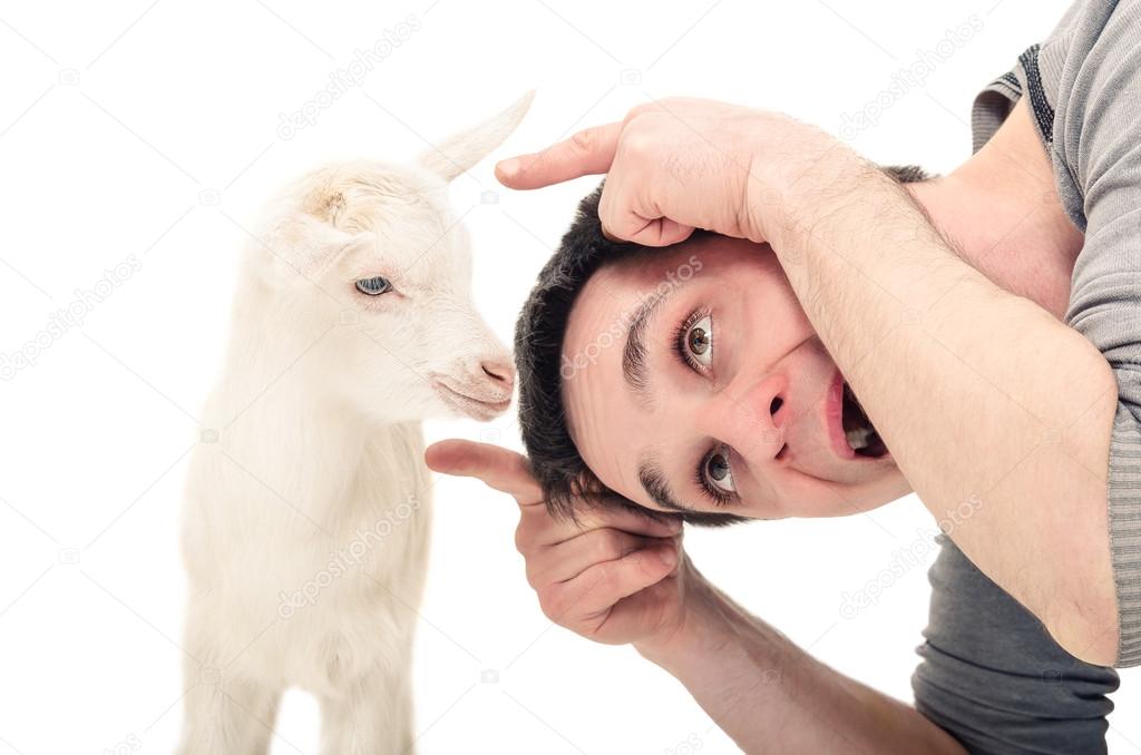 The comic image of a young man butts a little goat