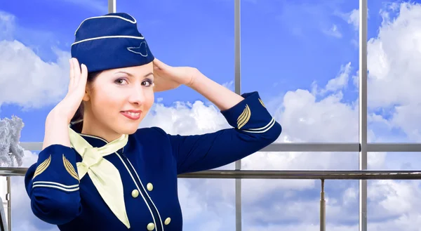 Smiling stewardess at the airport — Stock Photo, Image