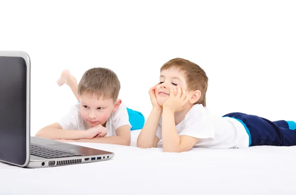 Two boys looking on laptop Stock Photo