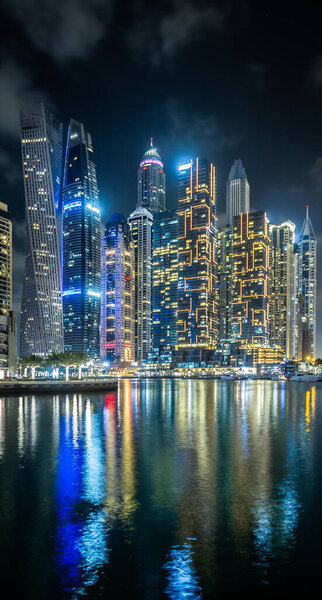 Dubai Marina Bay skyscrapers skyline at night, UAE