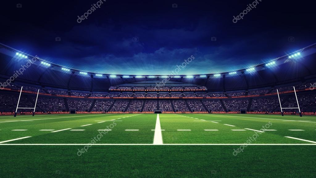 Rugby stadium with fans and green grass playground Stock Photo by