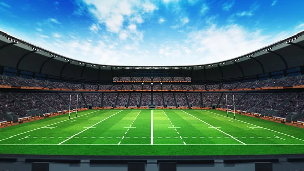 Stade de rugby avec ventilateurs et herbe verte à la lumière du jour — Photo