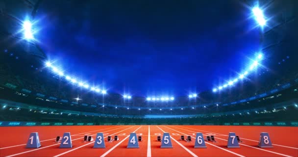 Modernes Leichtathletikstadion Mit Leuchtenden Lichtern Und Startblöcken Auf Der Laufstrecke — Stockvideo