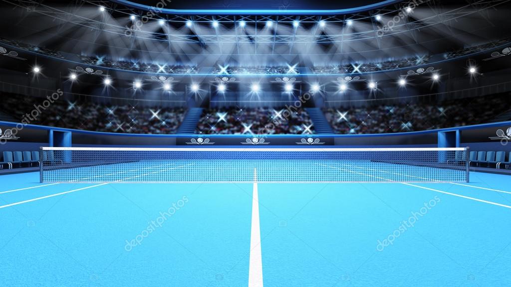 Blue tennis court view and stadium full of spectators with spotlights