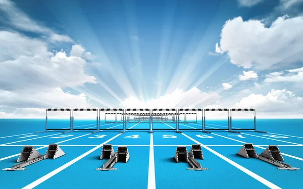 Race track with starting blocks and hurdles outside — Stock Photo, Image