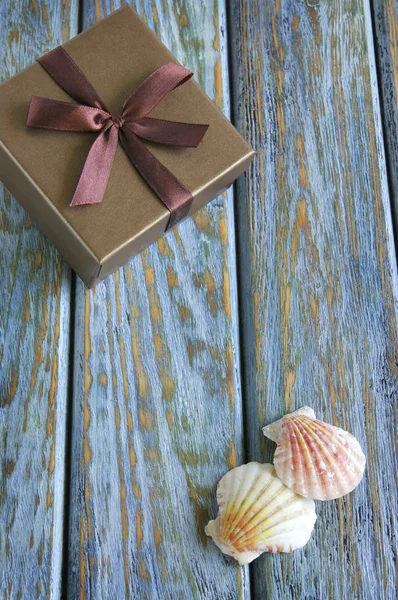 Giftbox on vintage wooden board — Stock Photo, Image
