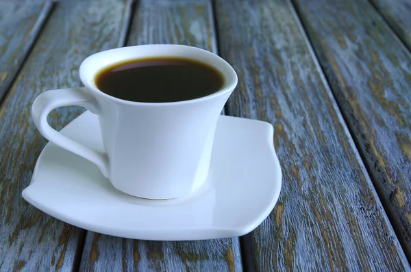 Kopp färsk espresso på bord Stockbild