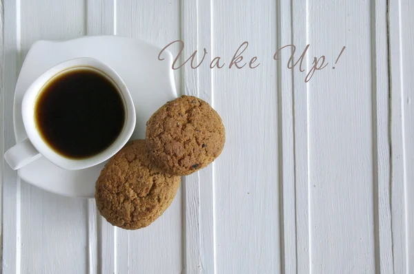 Надпись Wake Up with cup of coffee — стоковое фото