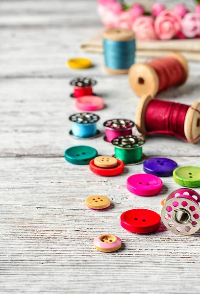 Buttons and spool of thread — Stock Photo, Image