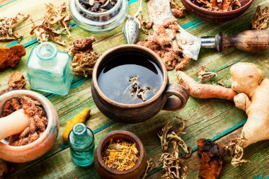 Herbal tea and a set of healing herbs, roots and bark.Alternative medicine