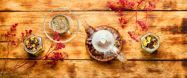 Healthy flower tea in a glass teapot.Natural herbs medicine