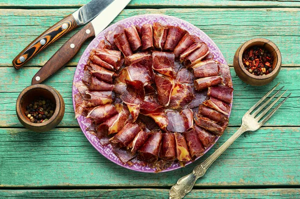 Sliced basturma or meat jerky.Beef jerky,dried beef on plate.Armenian food