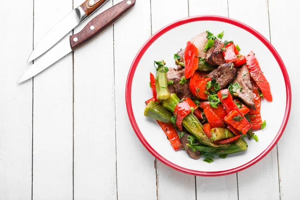 Salad with liver,bell pepper,okra and herbs.Healthy salad with liver