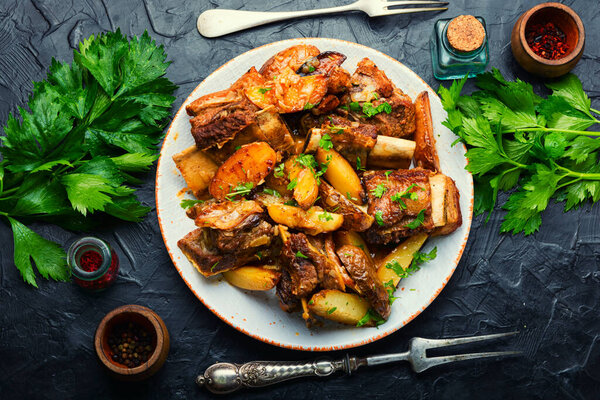 Tasty beef ribs stewed with potatoes.Beef ribs on the plate
