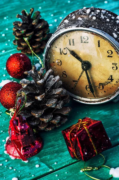 Old clock with Christmas decorations — Stock Photo, Image