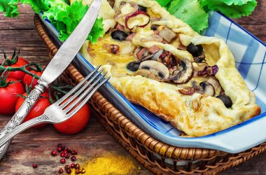 baking with dough with meat and mushrooms 