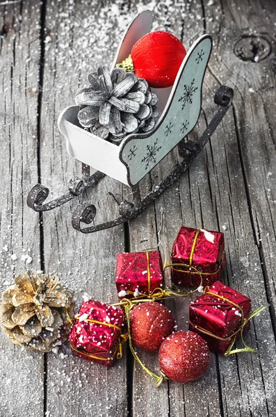 Christmas card with sleigh and ornaments — Stock Photo, Image