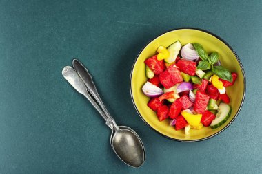 Watermelon and cucumber salad with fresh bell pepper, healthy summer food. Space for text.