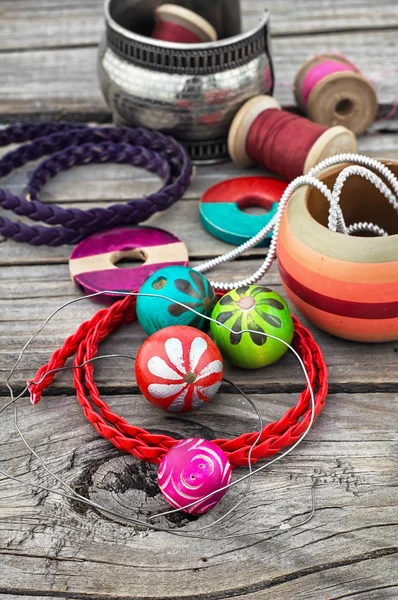 stock image beads on wooden background