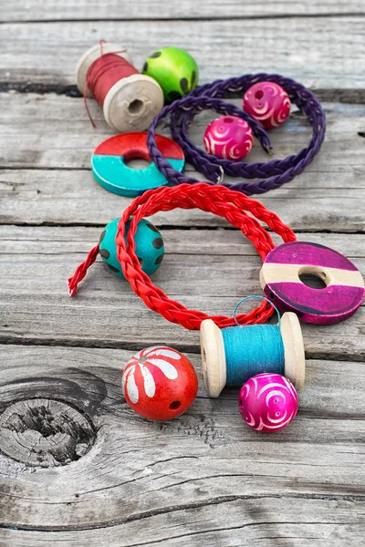 Beads on wooden background — Stock Photo, Image