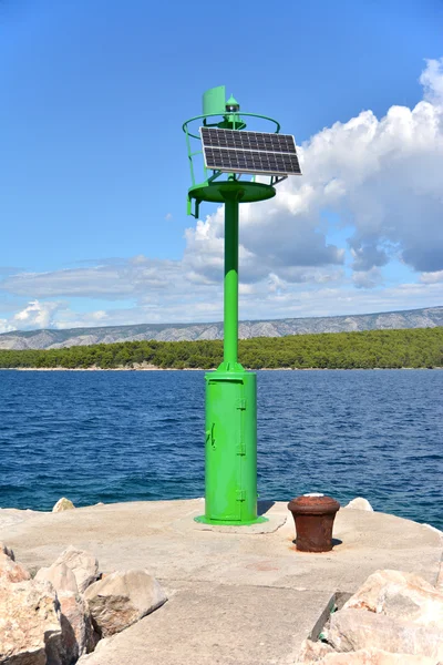 Small green solar lighthouse — Stock Photo, Image