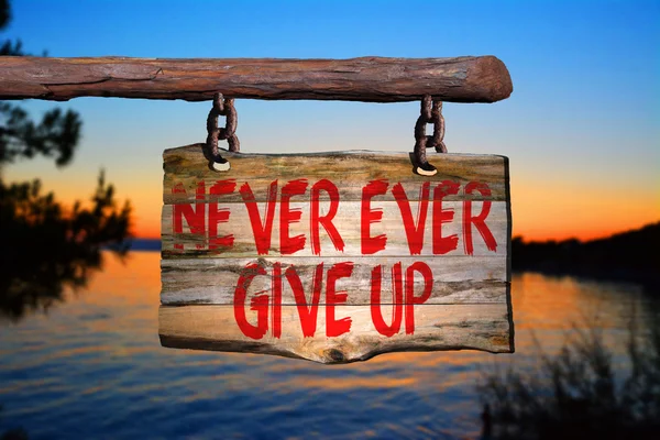 Never ever give up motivational phrase sign