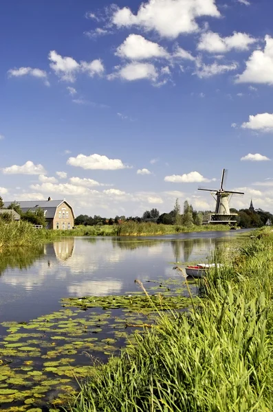 View along a dike with windmill — Stock Photo, Image