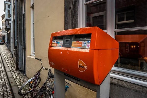Orange mailbox postal service of the Netherlands. — Stock Photo, Image