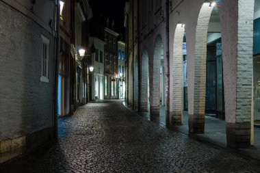 Street in the evening lights in the historic center clipart