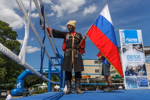 Russian Cossack with the Russian flag. — Stock Photo, Image