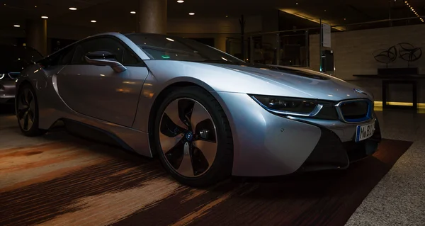 BERLIN - NOVEMBER 28, 2014: Showroom. The BMW i8, first introduced as the BMW Concept Vision Efficient Dynamics, is a plug-in hybrid sports car developed by BMW — Stock Photo, Image