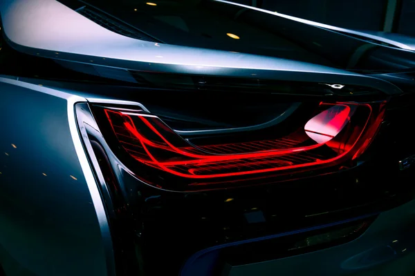 BERLIN - NOVEMBER 28, 2014: Showroom. The rear lights of the car BMW i8, first introduced as the BMW Concept Vision Efficient Dynamics, is a plug-in hybrid sports car developed by BMW. — Stock Photo, Image