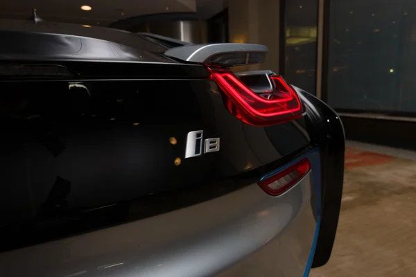 BERLIN - NOVEMBER 28, 2014: Showroom. The rear lights of the car BMW i8, first introduced as the BMW Concept Vision Efficient Dynamics, is a plug-in hybrid sports car developed by BMW. — Stock Photo, Image