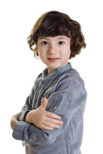Portrait of serious boy with arms folded. White background. — Stock Photo, Image