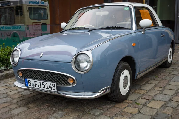 Городской автомобиль Nissan Figaro, 1991 — стоковое фото