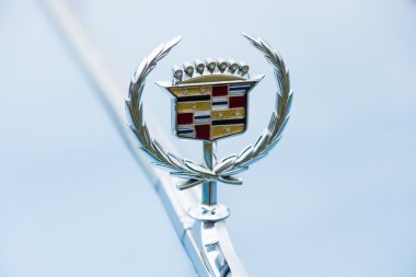 Emblem of a full-size luxury car Cadillac de Ville series, 1974 clipart